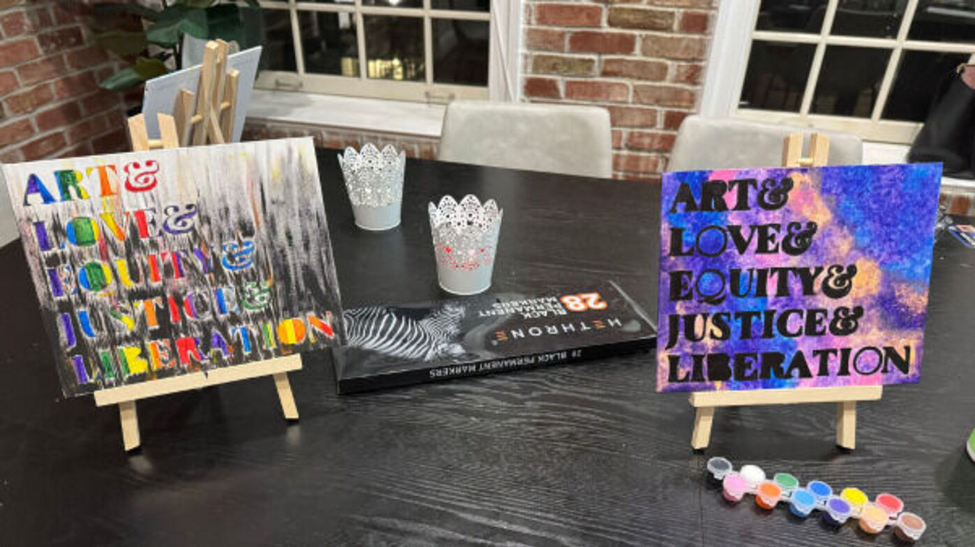 Two artworks on easels, featuring the text 